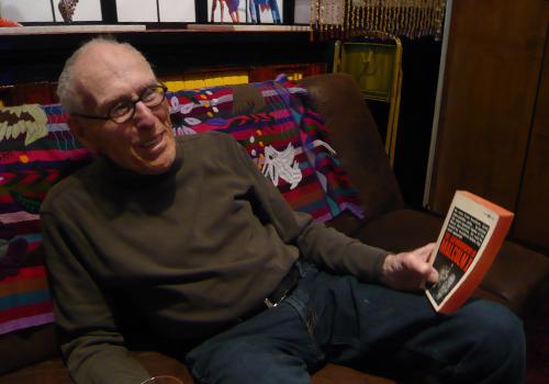 Barney Rosset holds his personal first-edition paperback of <em>The Autobiography of Malcolm X</em>. Barney Rosset holds his personal first-edition paperback of <em>The Autobiography of Malcolm X</em>.
